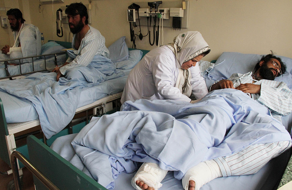 Afghan men who were injured in a suicide bomb attack targeted a volleyball match, receive medical treatment in a hospital, Kabul, Afghanistan, 24 November 2014. At least 45 people were killed and nearly 56 others injured when a suicide bomber attacked a volleyball match in Afghanistan.