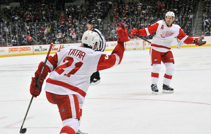 Tomas Tatar of the Detroit Red Wings celebrates one of his two goals with Niklas Kronwall in a game against the Winnipeg Jets on Thursday at the MTS Centre in Winnipeg.