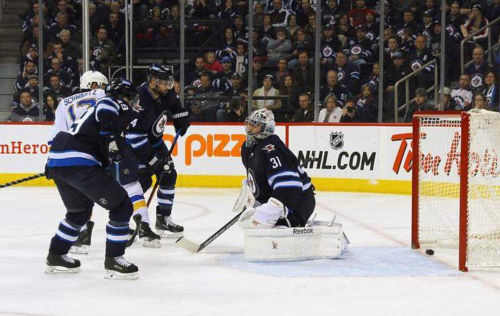 Goaltender Ondrej Pavelec of the Winnipeg Jets reacts as the puck is deflected into the net by Jaden Schwartz of the St. Louis Blues for a second-period goal Sunday at the MTS Centre in Winnipeg.