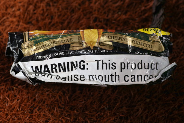 A pouch of chewing tobacco lays on the field before the Cleveland Indians MLB game against the Toronto Blue Jays on May 14, 2014 at Rogers Centre in Toronto, Ontario, Canada. 