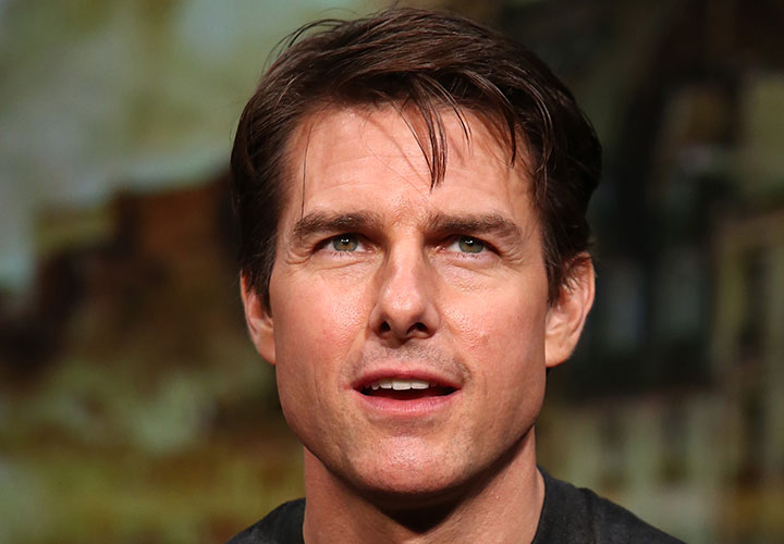 A new book details how actor Tom Cruise felt a Paramount executive was attacking his Scientologist beliefs.