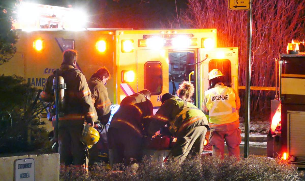 Firefighters perform CPR on one of the residents.