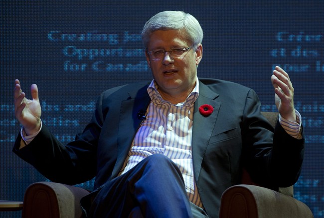 Canadian Prime Minister Stephen Harper responds during a question and answer session with Executive Chairman of Alibaba Group Jack Main in Hangzhou, China Friday November 7, 2014. 