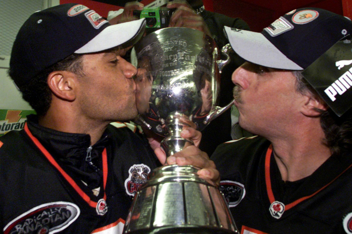 Damon Allen and Lui Passaglia celebrating their 2000 Grey Cup win.