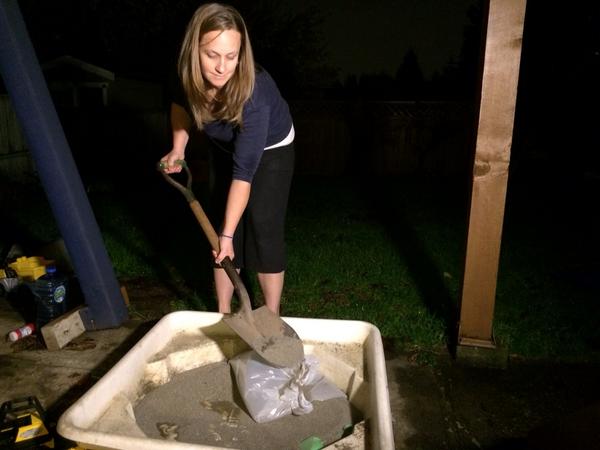In North Van, flood fears lead Julie Taylor to use sand from child's sandbox to make home made sandbags.