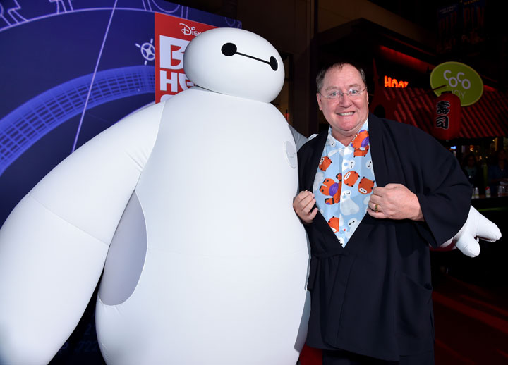 Chief Creative Officer at Pixar, Walt Disney Animation Studios and DisneyToon Studios John Lasseter (R) with character Baymax attends the Los Angeles Premiere of Walt Disney Animation Studios 'Big Hero 6'.