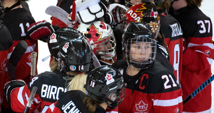 Members of team Canada celebrate their win over Finland following the third period preliminary round action of the Four Nations Cup women's hockey tournament in Kamloops, B.C., on Friday, Nov. 7, 2014. 