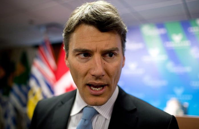 Mayor Gregor Robertson speaks to reporters during a news conference in Vancouver, B.C., on Wednesday December 11, 2013. THE CANADIAN PRESS/Darryl Dyck.