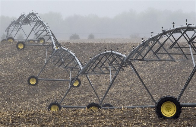FILE - In this April 19, 2012 file photo, an irrigation pivot remains still along highway 14, several miles near the proposed new route for the Keystone XL pipeline in Neligh, Neb.