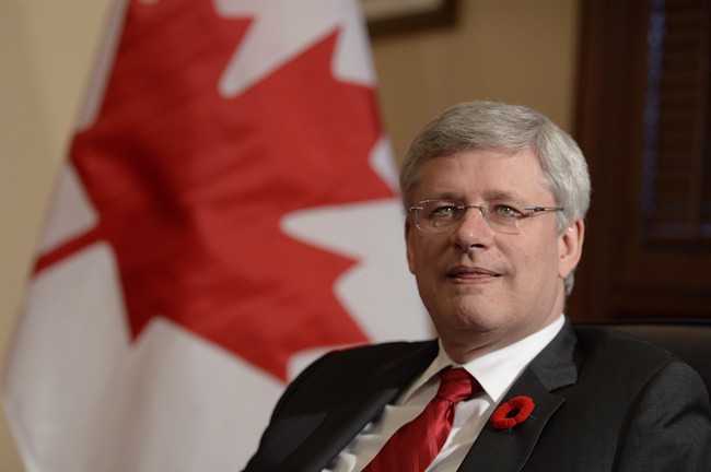 Canadian Prime Minister Stephen Harper is shown in his office Friday October 31, 2014 in Ottawa.