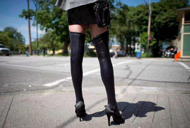 A sex trade worker is pictured in downtown Vancouver, on June, 3, 2014. 