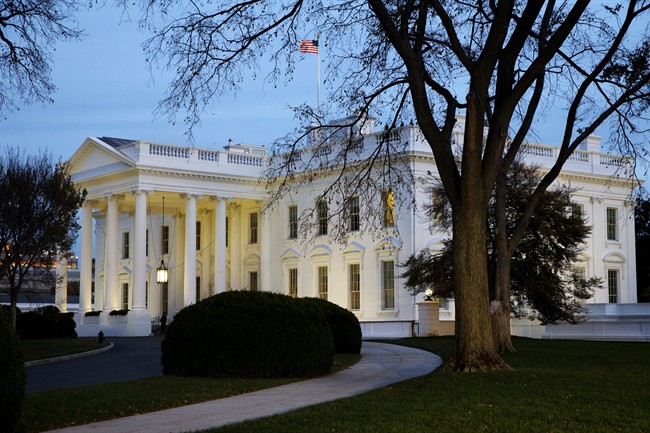The White House is seen at dusk in Washington, Wednesday, Nov. 19, 2014.