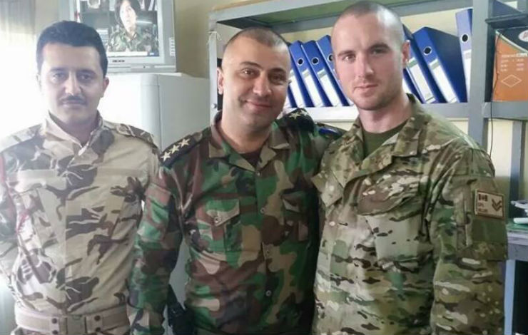 An image of Dillon Hillier (right) with Kurdish Peshmerga fighters in Iraq, shared on the Facebook page of the 1st North American  Expeditionary Force.