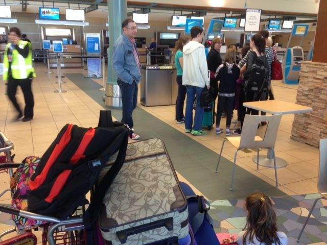 Three families received the bad news on Friday that their flights to Disneyland were overbooked, which meant a lot of upset children.
