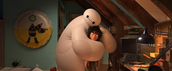 This image released by Disney shows animated characters Hiro Hamada, voiced by Ryan Potter, right, and Baymax, voiced by Scott Adsit, in a scene from "Big Hero 6.".