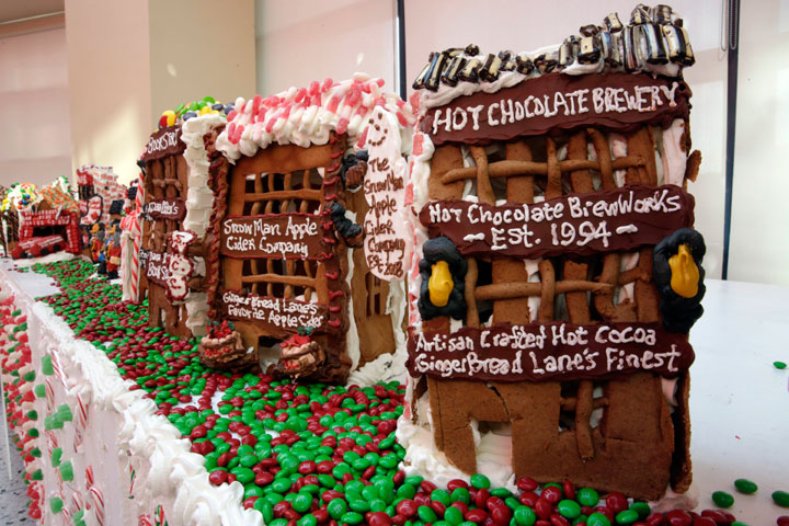 Some of the gingerbread house creations by Chef Jon Lovitch are displayed in his GingerBread Lane, at the New York Hall of Science, in the Queens borough of New York, Thursday, Nov. 13, 2014. Lovitch, a Manhattan chef who holds the Guinness record for creating the world's largest collection of gingerbread houses, is now going for another record, competing against himself by assembling more than 1,000 new ones.