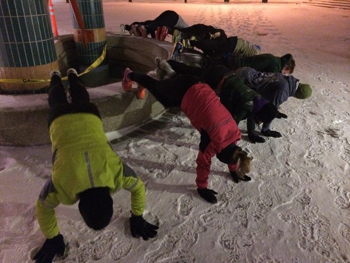 Participants do push-ups at the Forks during November 19th's Winnipeg Gone Rogue workout.