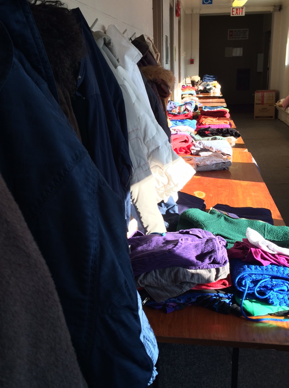 Donations pile up at the St. Norbert Community Centre for the two families who lost their homes in a fire Wednesday.