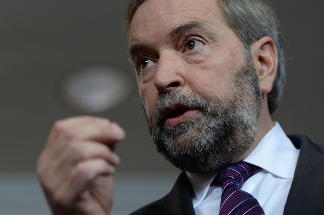 NDP Leader Tom Mulcair answers a question during a press conference in Ottawa on Nov. 19, 2014.