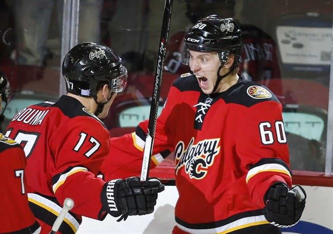 File photo of Calgary Flames' Markus Granlund, right, and Lance Bouma, left, from Nov. 15, 2014.