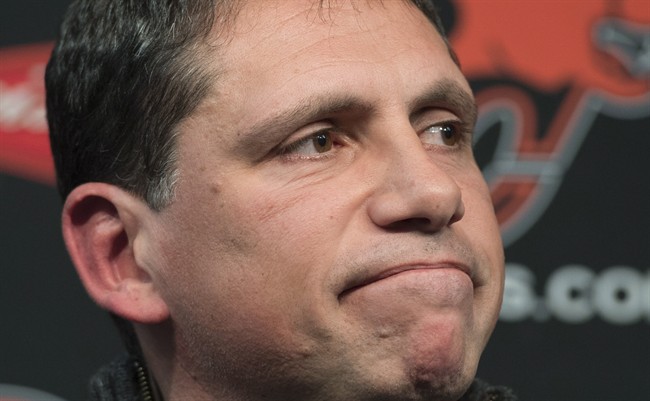 B.C. Lions head coach Mike Benevides pauses for a moment during a news conference at the team's practice facility in Surrey, B.C., on Monday, Nov. 17, 2014. The Lions announced Thursday that they have fired Benevides. THE CANADIAN PRESS/Jonathan Hayward.