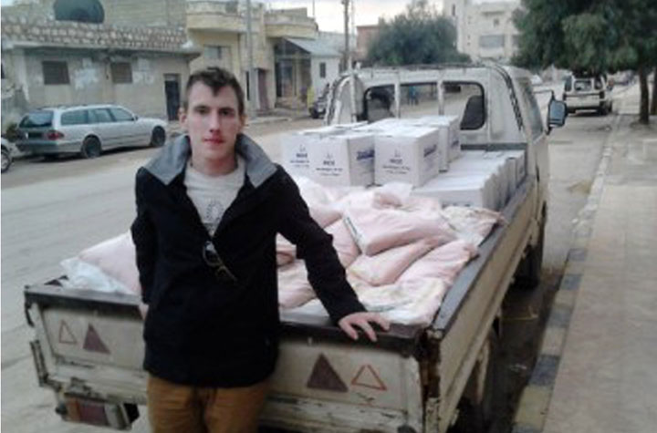 In this undated photo provided by the Kassig Family, Peter Kassig is shown with a truck loaded with supplies.