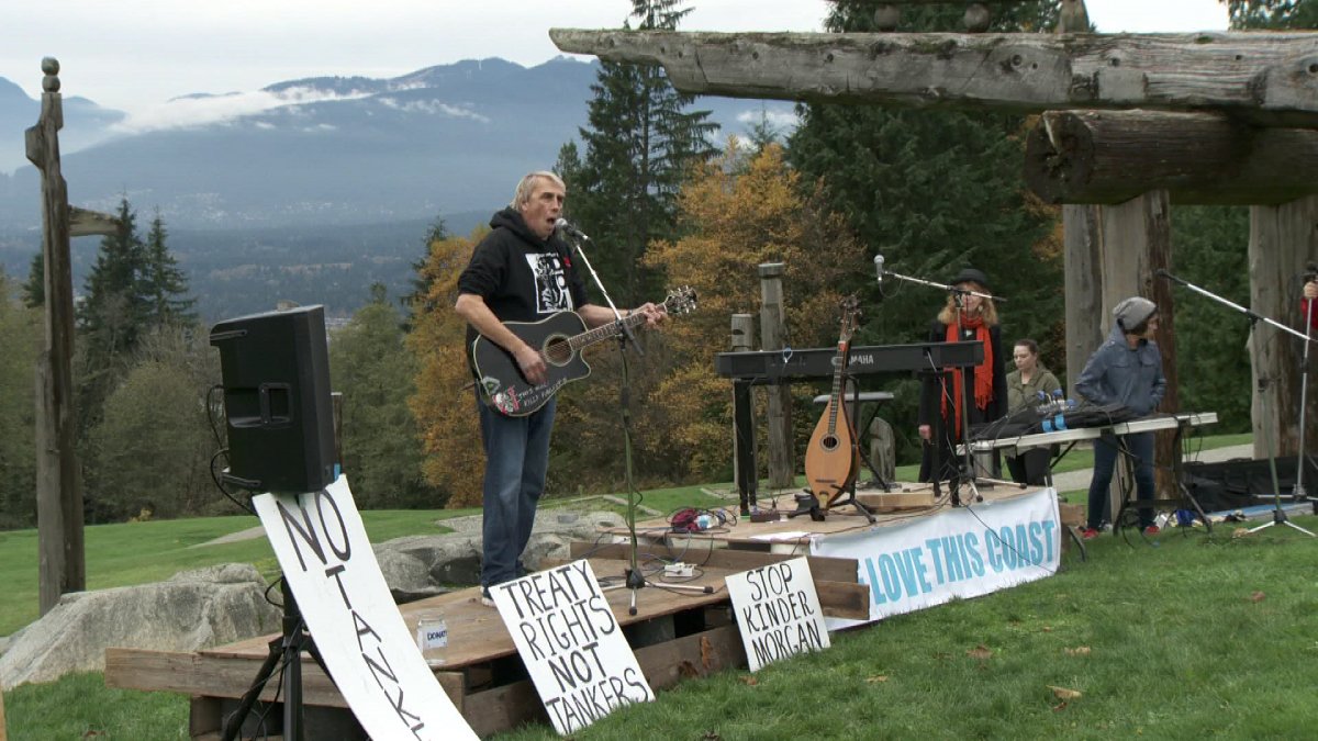Joe Keithley of D.O.A. fame entertains people attending a concert on Burnaby Mountain to benefit Kinder Morgan protesters.