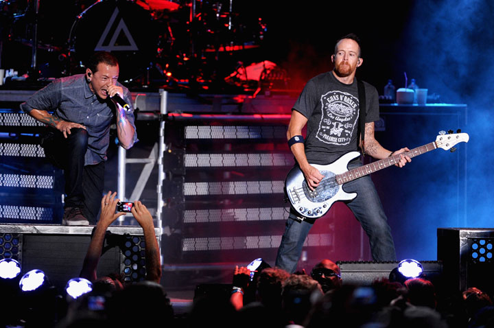 Recording artists Chester Bennington (L) and Dave Farrell of music group Linkin Park perform onstage at the MTVu Fandom Awards during Comic-Con International 2014 at PETCO Park on July 24, 2014 in San Diego, California.