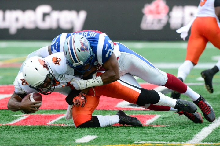 Montreal Alouettes linebacker Kyries Hebert sacks B.C. Lions quarterback Kevin Glenn during action in the CFL Eastern Semifinal game in Montreal, Sunday, Nov.16, 2014. 