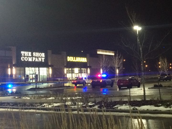 Police investigate after three men were shot in the parking lot of Manning Town Centre Friday, Nov. 21, 2014.