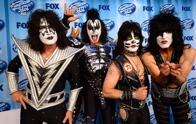 This May 21, 2014, file photo shows Tommy Thayer, and from left, Gene Simmons, Eric Singer, and Paul Stanley, of the musical group KISS, posing in the press room at the American Idol XIII finale at the Nokia Theatre at L.A. 
