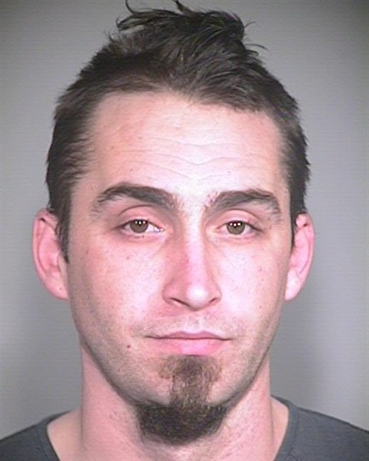 This image released by the Portland, Ore., Police Bureau, shows David Kalac, 33, who police say is a suspect in the killing of a woman in Port Orchard, Wash., where graphic photos of the victim's body were posted online hours before before police found the body. ( AP Photo/Portland Police Bureau).