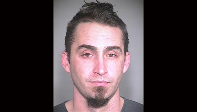 This image released by the Portland, Ore., Police Bureau, shows David Kalac, 33, who police say is a suspect in the killing of a woman in Port Orchard, Wash., where graphic photos of the victim's body were posted online hours before police found the body.
