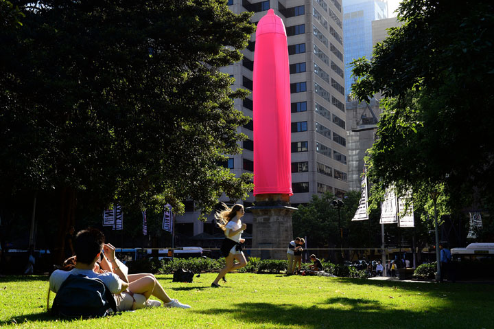 A giant condom is seen over a heritage-listed obelisk at Hyde Park in Sydney on November 7, 2014. 