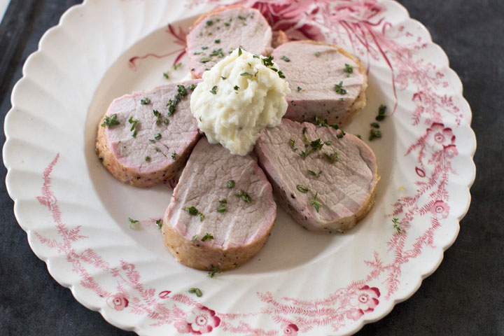 This Nov. 10, 2014 photo shows pork tenderloin with garlic potato puree in Concord, N.H. Pork tenderloin is delicious, tender, and is neutral enough to pair wonderfully with numerous ingredients.