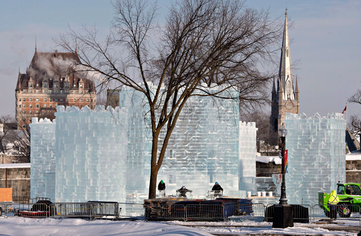 Workers put the finishing touches on the carnival ice castle during -18C temperatures in Quebec City, Wednesday, January 22, 2014.
