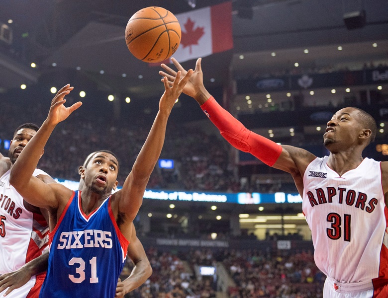 Toronto Raptors Terrence Ross (right) battles for the ball with Philadelphia 76ers Hollis Thompson during first half NBA action in Toronto on Sunday November 9, 2014.