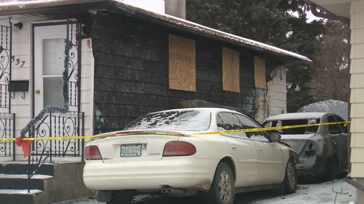 Investigators are looking at a block heater as the possible cause of an overnight fire that damaged two cars and two houses in Regina.