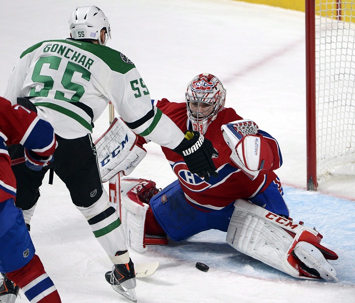 Montreal Canadiens goalie Carey Price (31) stops Dallas Stars defenceman Sergei Gonchar (55) during third period NHL hockey action against the Dallas Stars in Montreal on Tuesday, October 29, 2013. 