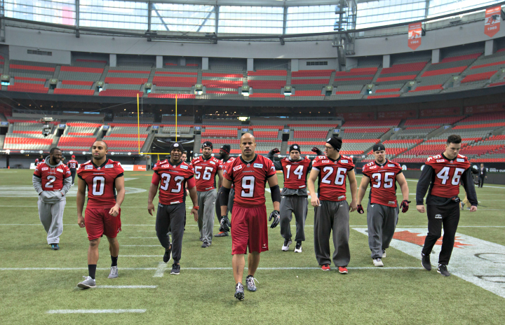 Calgary Stampeders' running back Jon Cornish (9) leads his teammates off the field after a Grey Cup walkthrough in Vancouver, B.C., on Saturday November 29, 2014. 