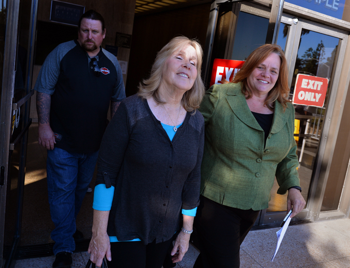 Susan Mellen, center, leaves Torrance Superior Court where she was declared factually innocent for a murder she spent 17 years in prison for, Friday, Nov. 21, 2014, in Torrance, Calif.  