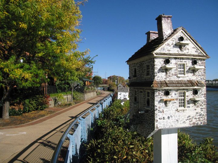 This Oct. 26, 2014 photo shows one of a series of birdhouses on the Riverwalk along the Christina River in Wilmington, Del. The birdhouses were created by artist Thomas Burke, who drew inspiration from houses depicted in paintings by the late Andrew Wyeth. The Riverwalk also offers a meandering stroll with benches, rail reeds, water views and signs about various aspects of local history.