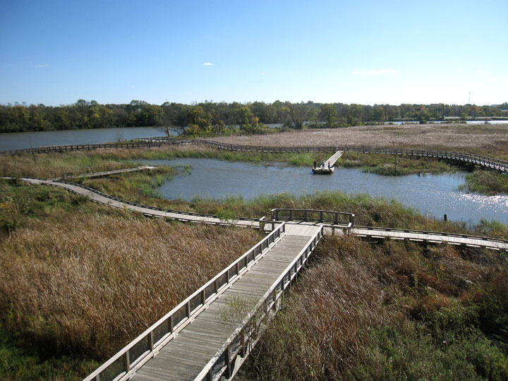 This Oct. 26, 2014 photo shows the Russell Peterson Urban Wildlife Refuge, a waterfront park along the Christina River in Wilmington, Del. The park includes paths to a pond, and through a tidal marsh lined with tall reeds and colorful flowers.
