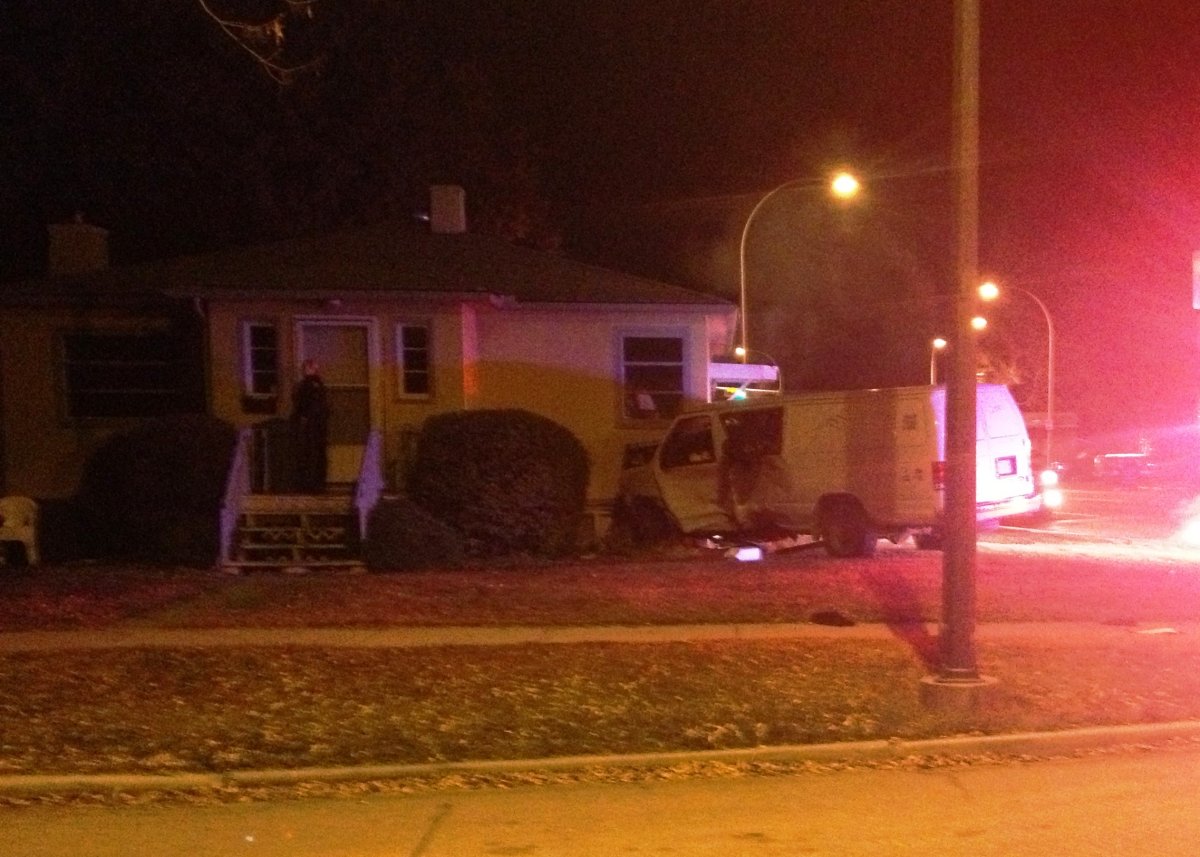 Police investigate after a van crashes into a home along 11th Avenue N.E. on Thursday, November 6th, 2014.  