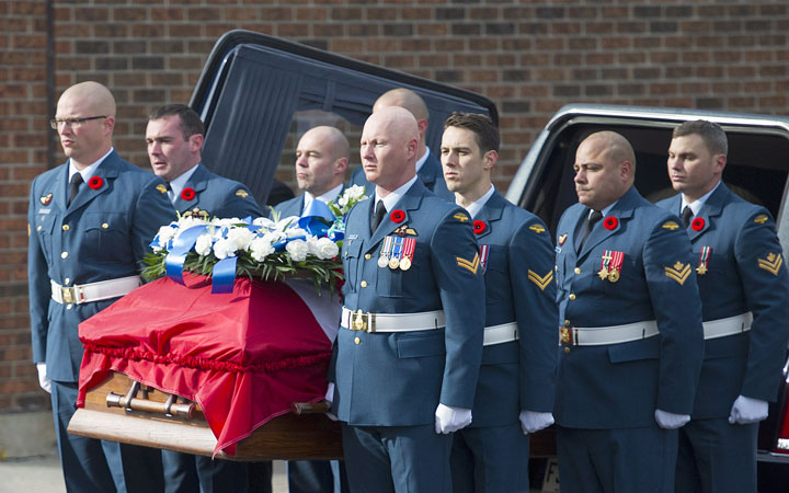 The casket containing the remains of warrant officer Patrice Vincent arrives for his funeral in Longueuil, Que.