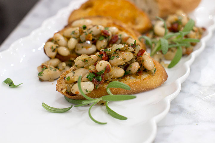 This Nov. 17, 2014 photo shows winter white bean bruschetta in Concord, N.H. In Italy a reliance on delicious whole ingredients and bold flavors means there are plenty of small bites perfect a celebration.
