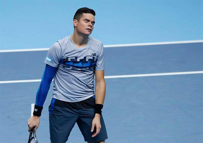 Milos Raonic reacts in frustration after losing a point against Britain’s Andy Murray during their singles ATP World Tour tennis finals match at the O2 arena in London, Tuesday, Nov. 11, 2014. 