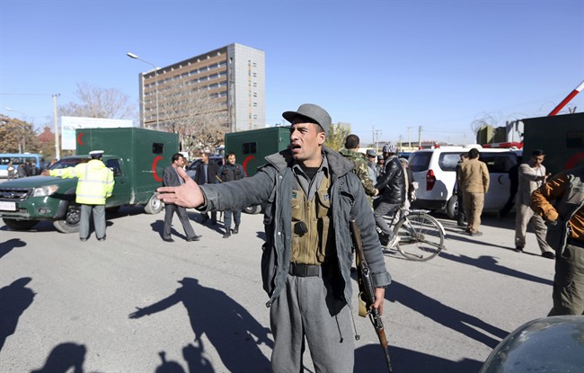 Afghan police inspect the site of a suicide attack in Kabul, Afghanistan, Sunday, Nov. 9, 2014. 