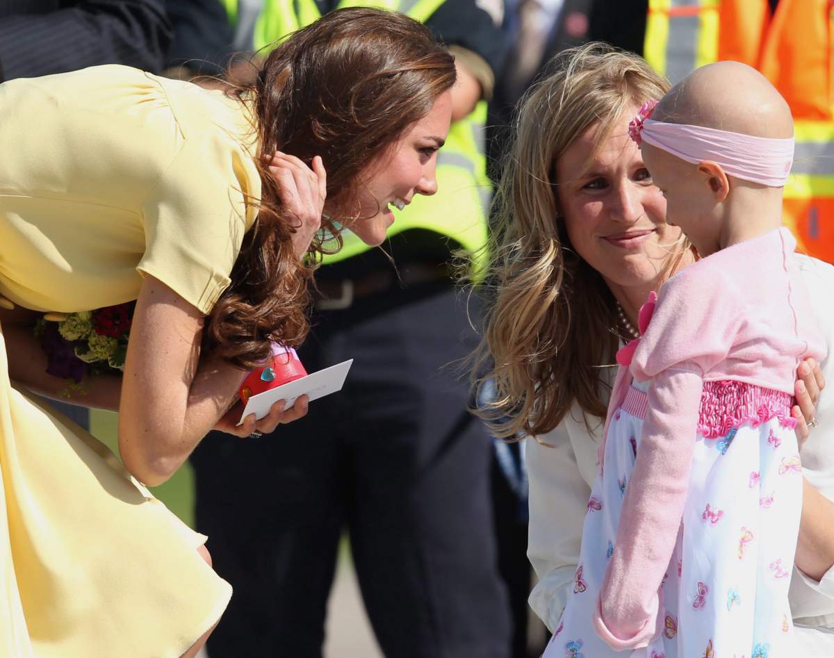 The Duchess of Cambridge greets six-year-old Diamond Marshall as they arrive in Calgary Thursday, July 7, 2011.