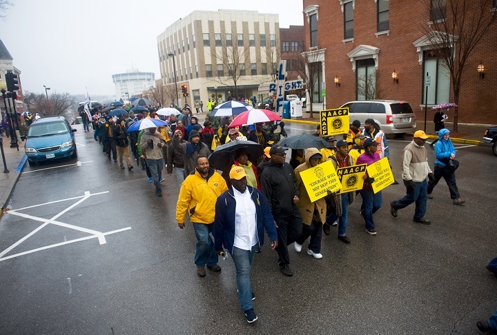 Protesters march toward the Missouri Capitol, Friday, Dec. 5, 2014 in Jefferson City, Mo.